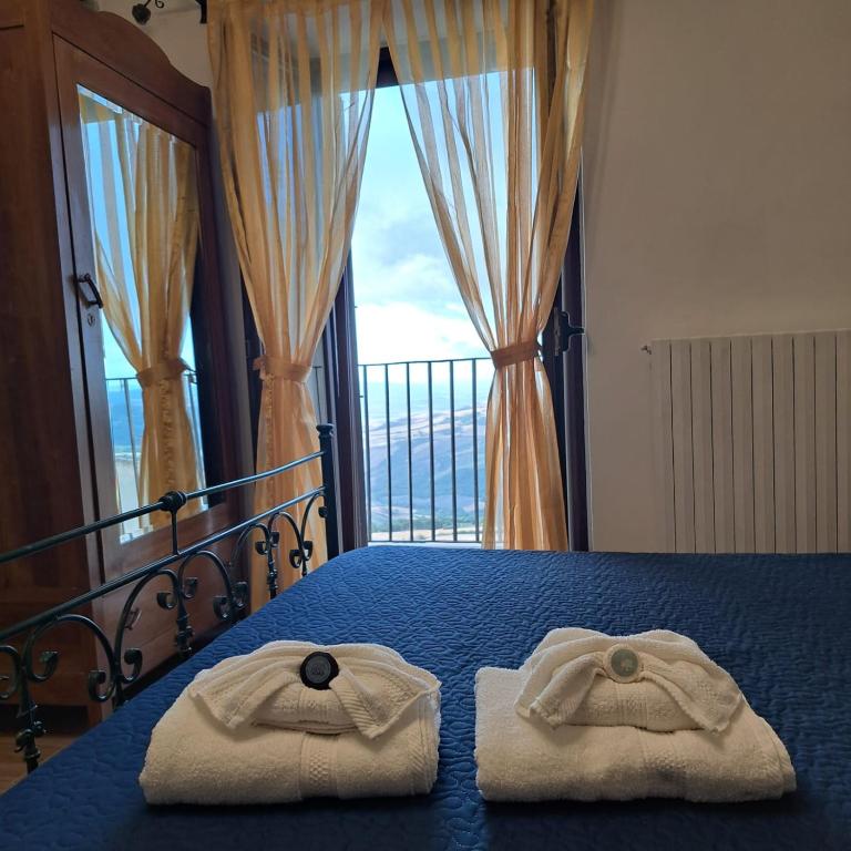 Postel nebo postele na pokoji v ubytování AL BELVEDERE