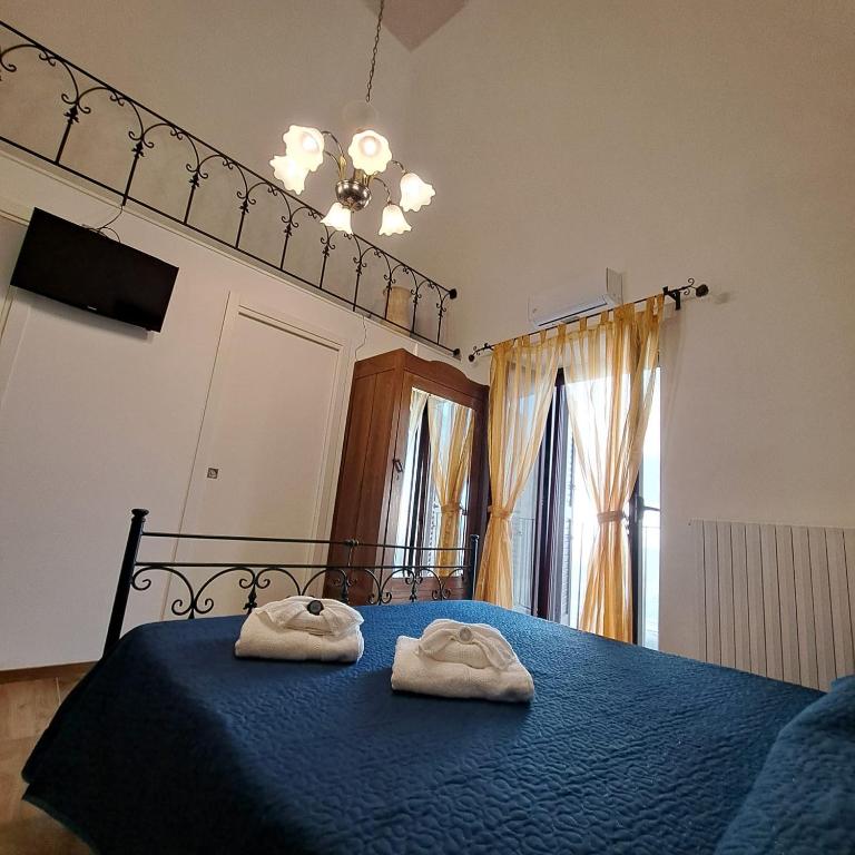 Postel nebo postele na pokoji v ubytování AL BELVEDERE