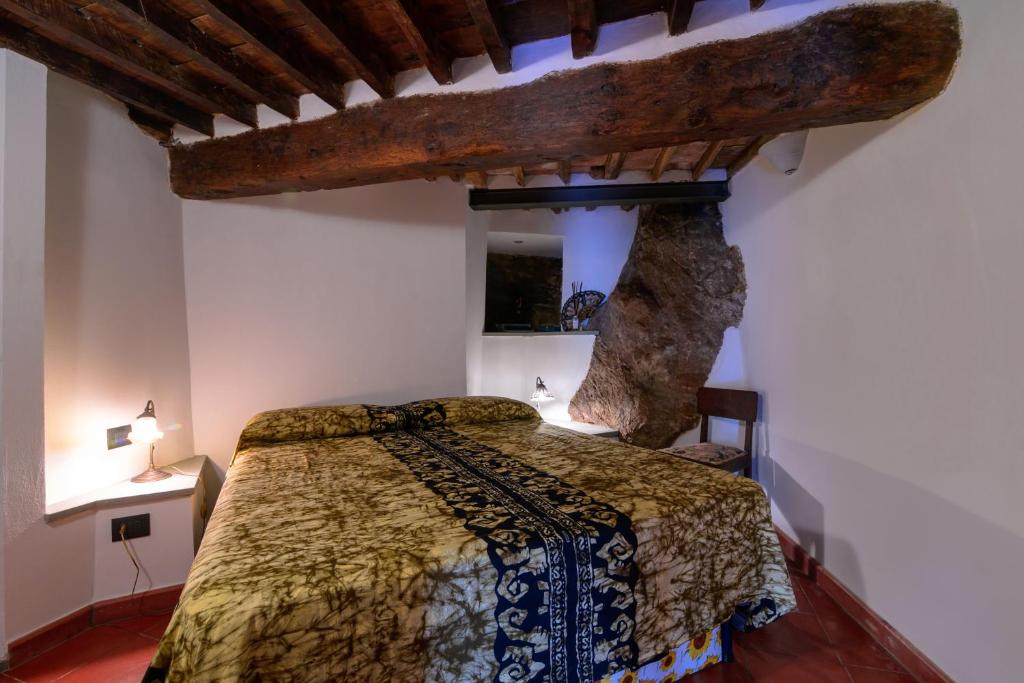 Ένα ή περισσότερα κρεβάτια σε δωμάτιο στο Taverna delle Mura