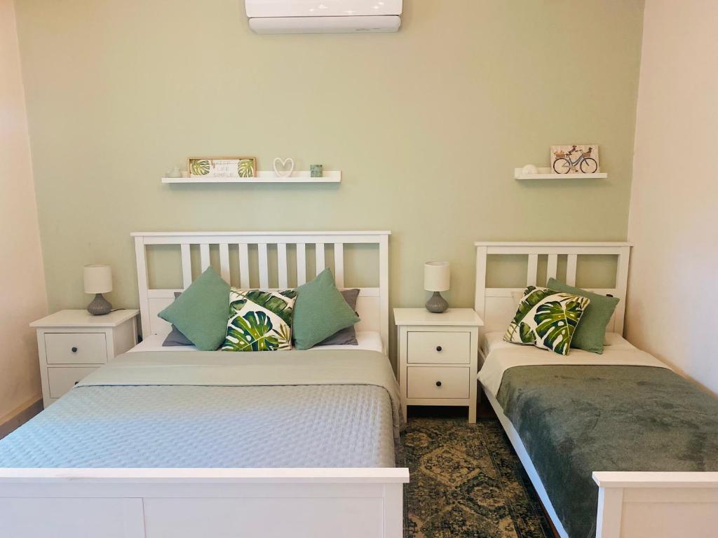 Postel nebo postele na pokoji v ubytování Szélcsend Apartman