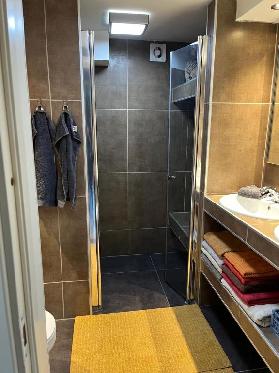 a bathroom with a shower and a sink at Villa chaimae in Lii
