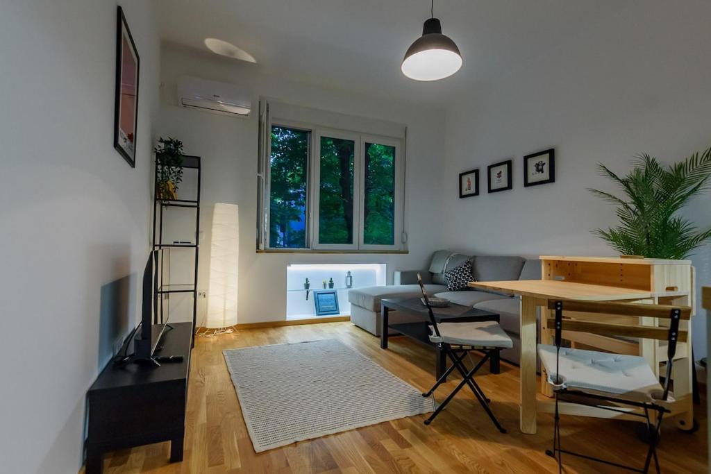 a living room with a couch and a table at Studio 44 in Belgrade