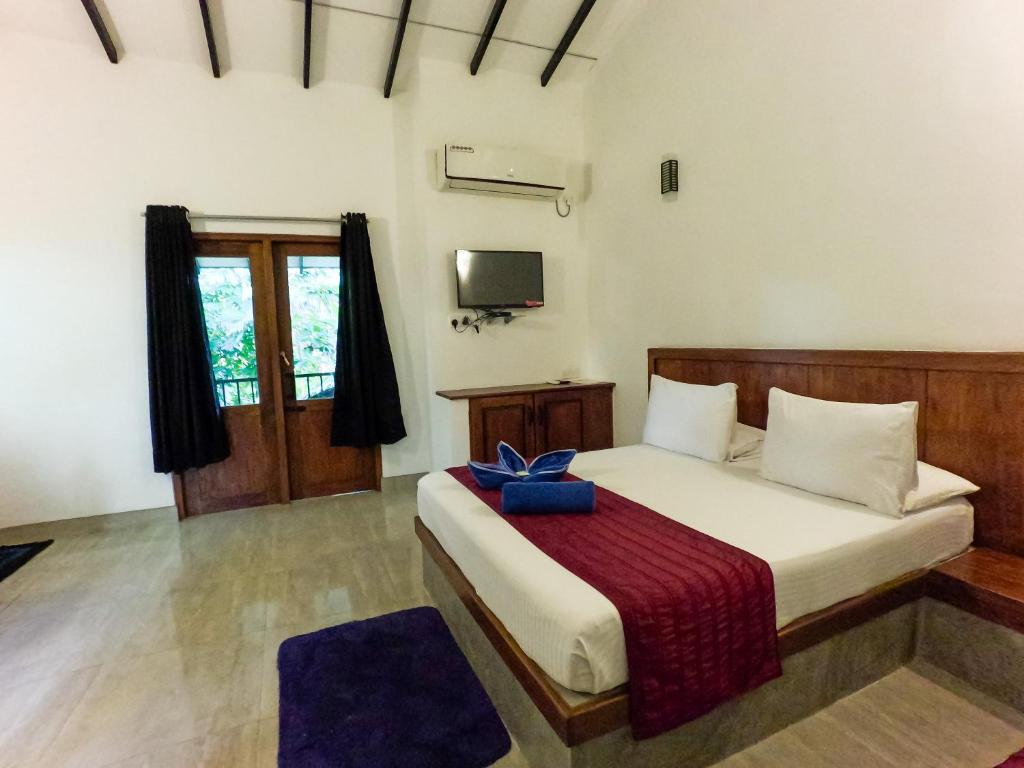 Ένα ή περισσότερα κρεβάτια σε δωμάτιο στο Orient Lodge - Galewela