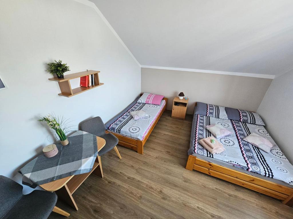 Postel nebo postele na pokoji v ubytování Apartament Regina