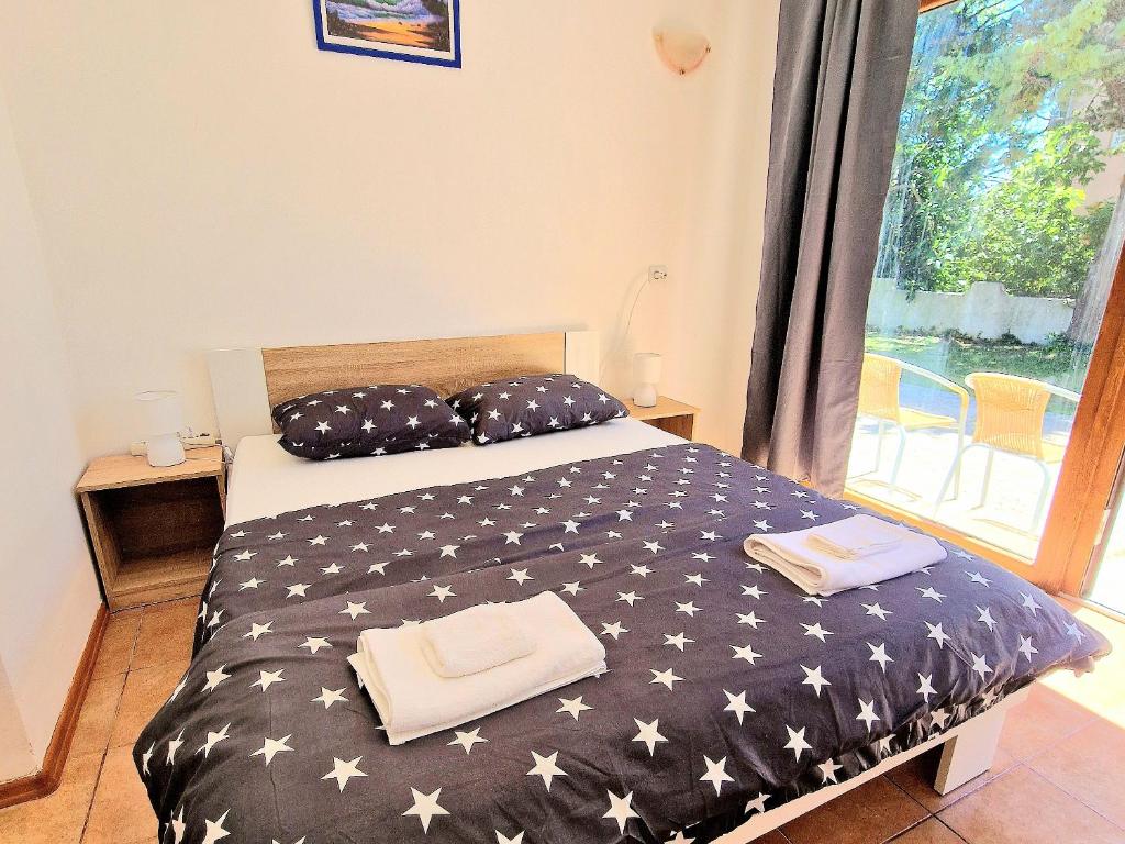 Ένα ή περισσότερα κρεβάτια σε δωμάτιο στο D&D Rooms 2