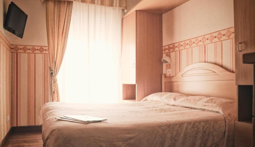 Postel nebo postele na pokoji v ubytování Hotel Siviglia