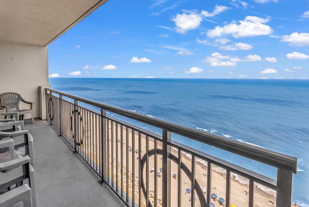 a balcony with a view of the ocean at 19th Floor Oceanfront - Panoramic Views - Sleeps 10 - Caribbean Resort in Myrtle Beach