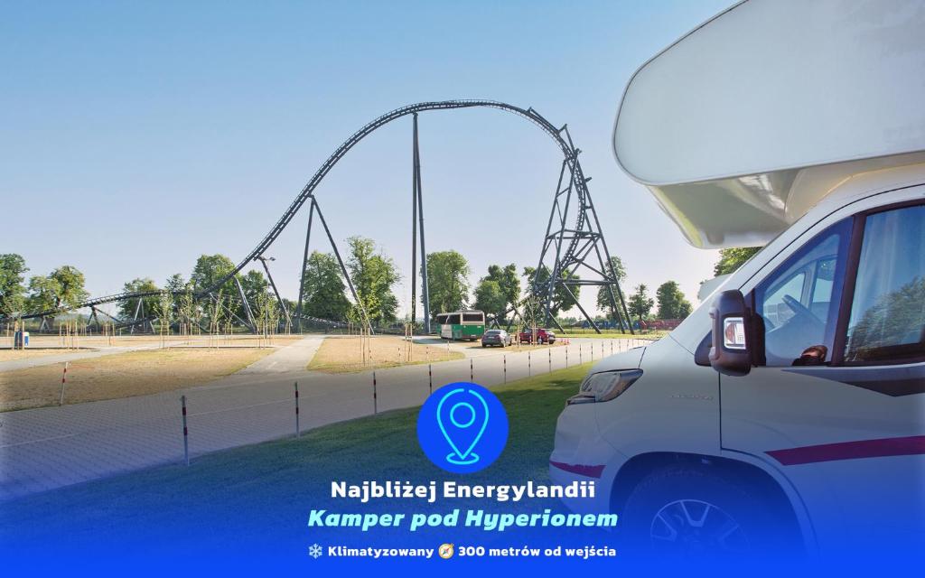 a car parked in front of a roller coaster at Encar - Bliżej nie będzie in Zator