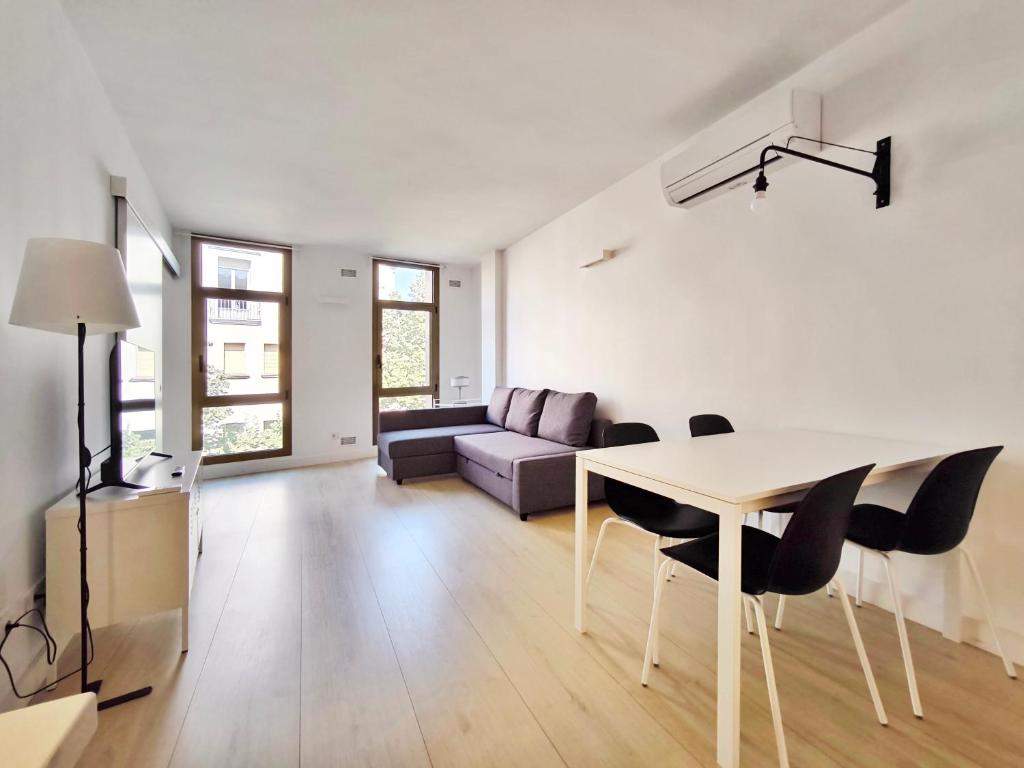 TV a/nebo společenská místnost v ubytování Apartamento céntrico, moderno, Terrassa Rambla