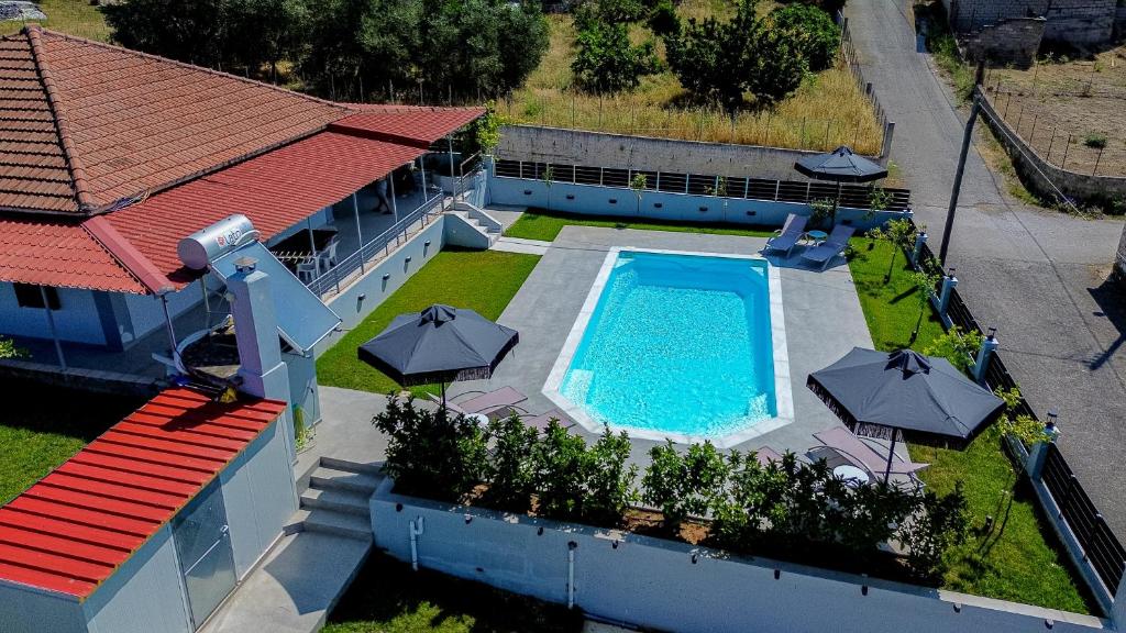 an aerial view of a house with a swimming pool at NS Villa Archangelos in Archángelos