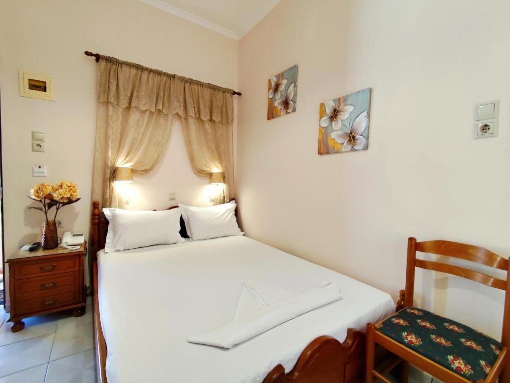 Postel nebo postele na pokoji v ubytování Hotel Anagennisis