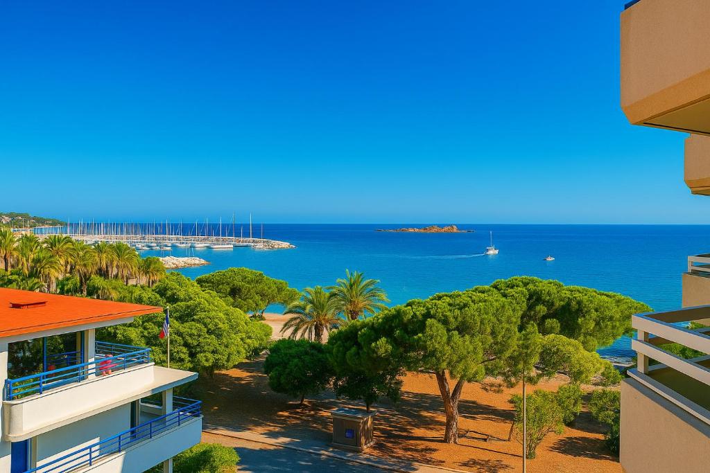 a view of the ocean from a building at Bleu Azur -Vue Mer 6e Etage - Triangle d'Or in Saint-Raphaël