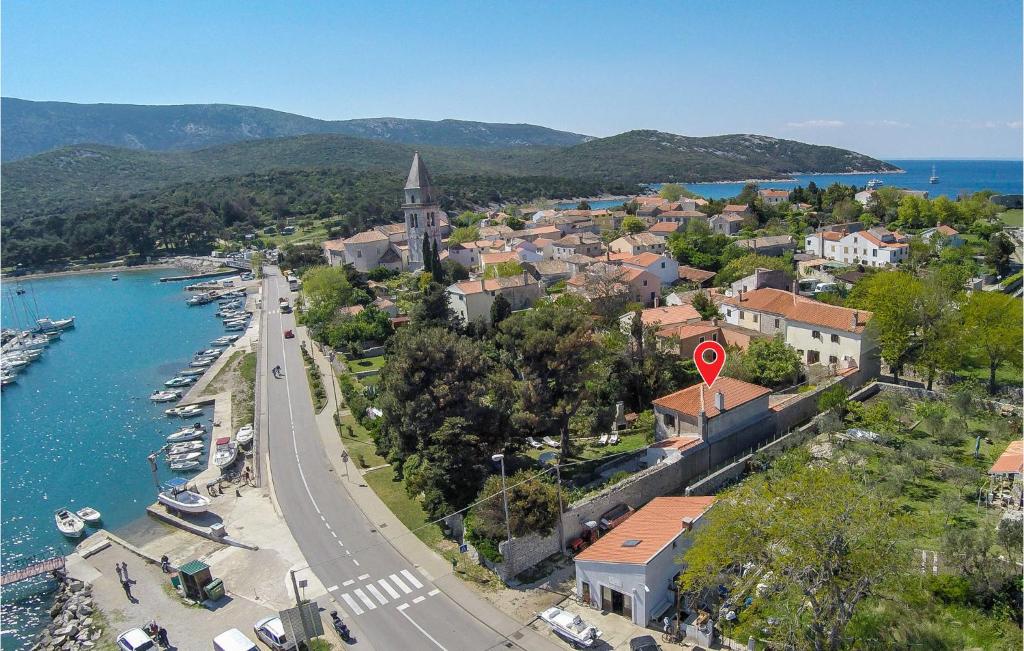 a city with a river and a town with a street at Pet Friendly Home In Osor in Osor