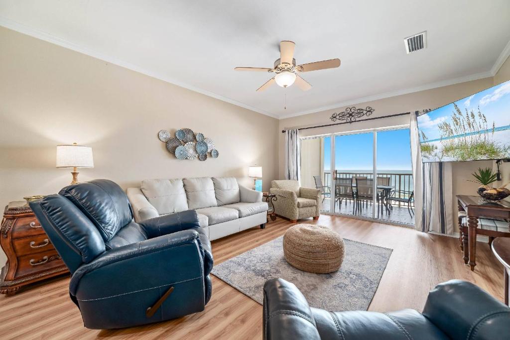 a living room with a couch and a table at Marlin Key 3B in Orange Beach