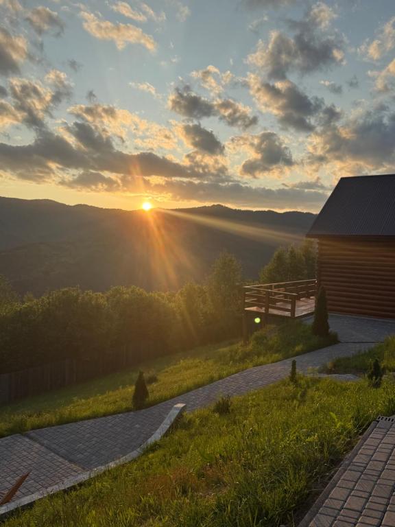 a view of the sunset from a cabin at Садиба Трембіта з сауною та чаном in Rakhiv