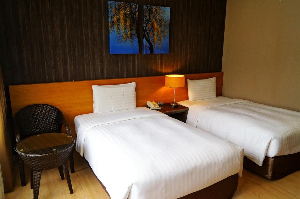 Postel nebo postele na pokoji v ubytování Lealea Garden Hotels - Sun Lake