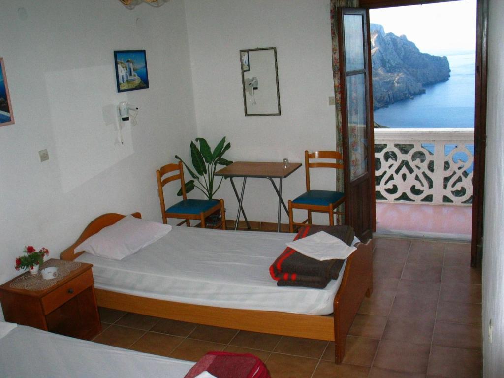 Postel nebo postele na pokoji v ubytování Aphrodite Hotel