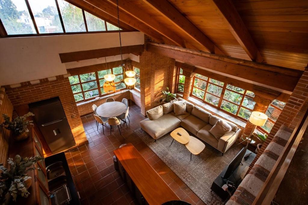 an overhead view of a living room with a couch and a table at David's Den Atitlán in Panajachel