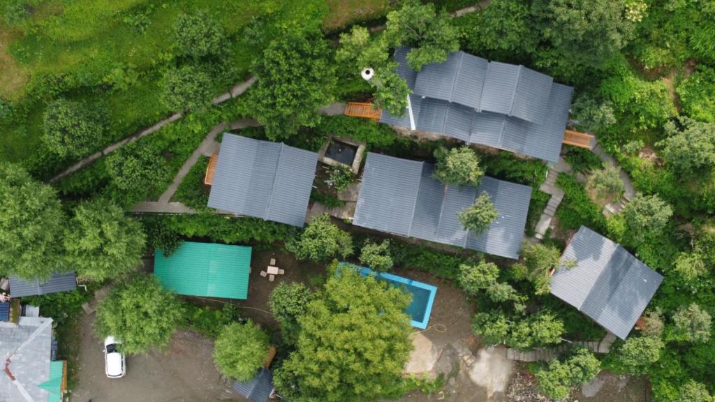 an overhead view of a yard with solar panels at Acoustic Himalayas Jibhi in Jibhi