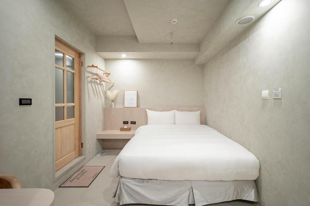 Voodi või voodid majutusasutuse 慶爾喜旅館長沙館Cheers Loft Self Check-in Hotel toas