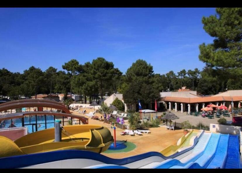 a water park with a water slide and a pool at mobil home ronce le bain in La Tremblade