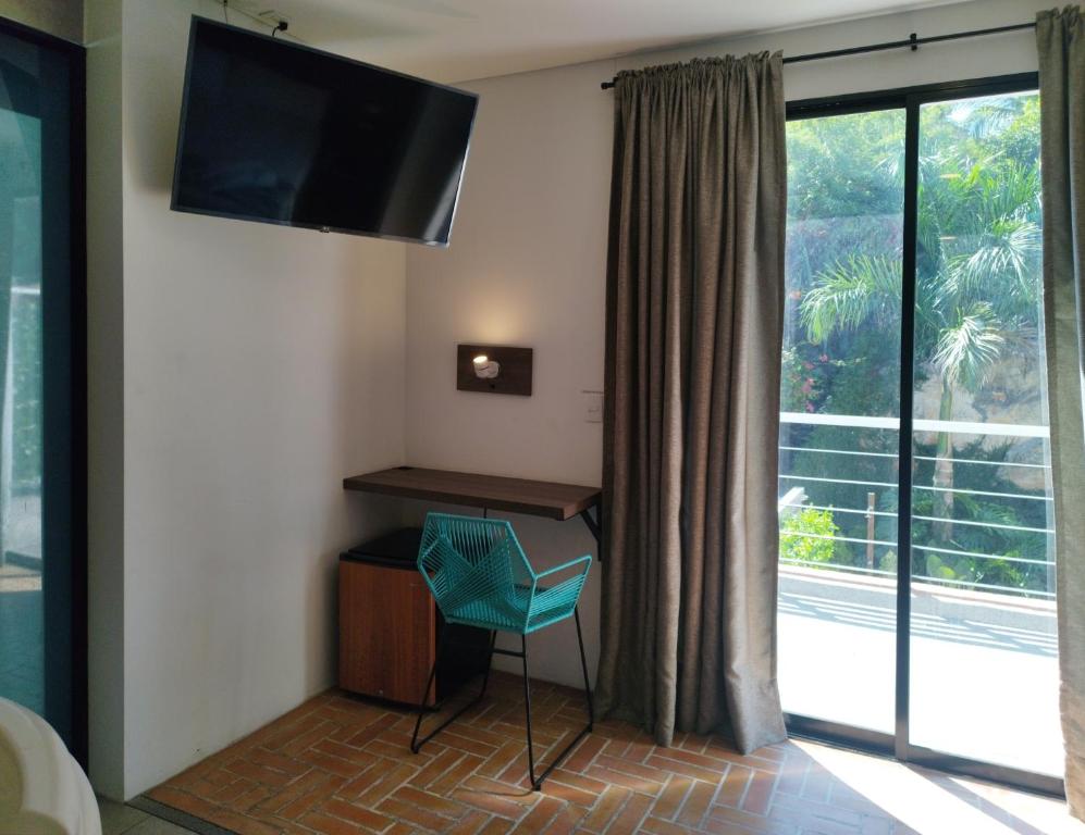 TV a/nebo společenská místnost v ubytování Hotel Macaw Cúcuta