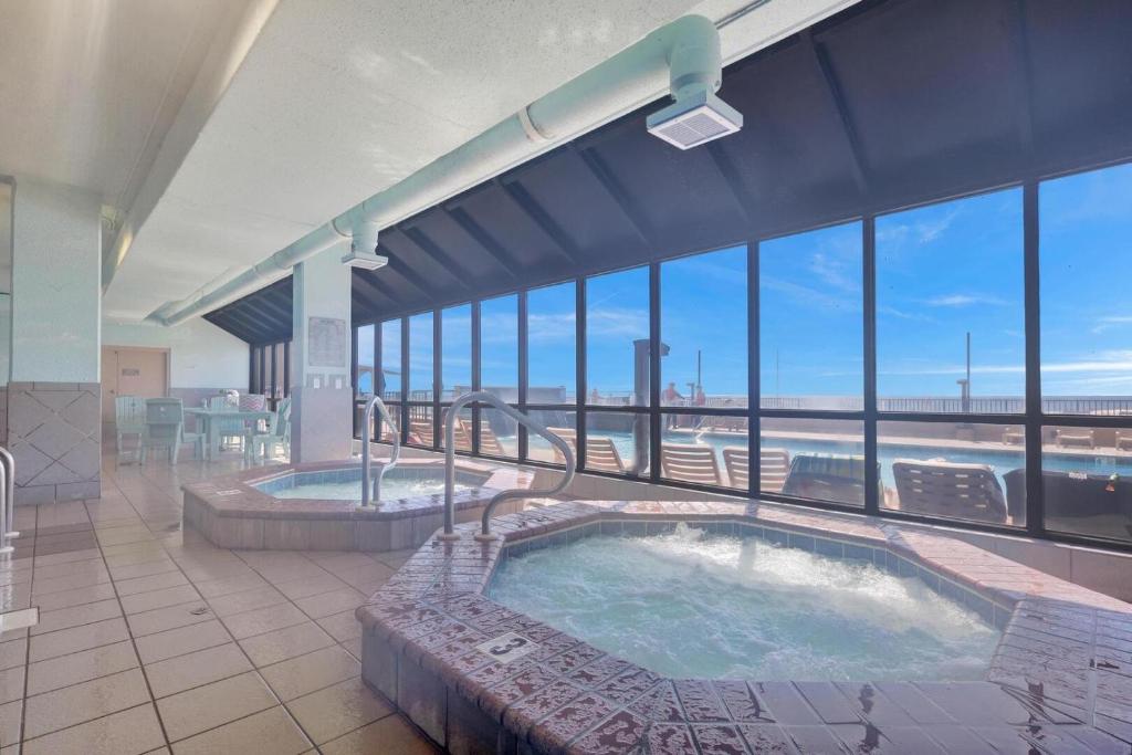 an indoor hot tub in a building with a view at Beachfront Condo w/ View & Pool, Sleeps 8 in Orange Beach