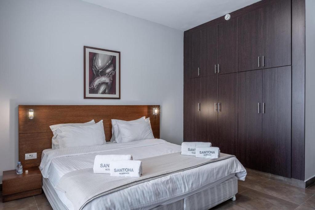 Postel nebo postele na pokoji v ubytování Santona Residence