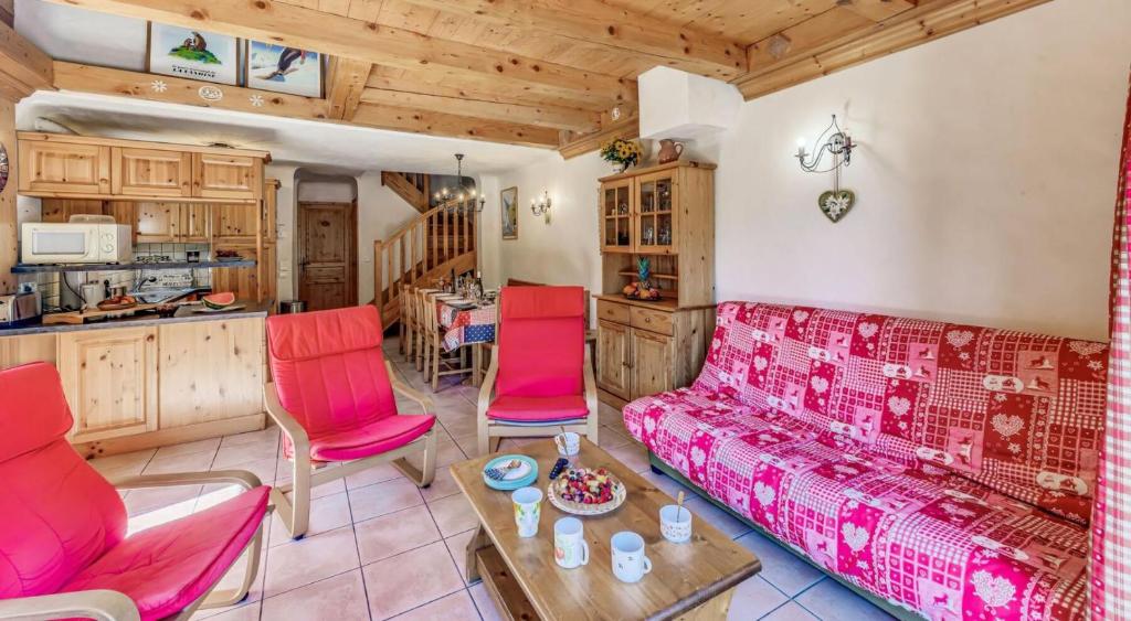 a living room with a red couch and red chairs at Résidence Les Soldanelles - Chalets pour 10 Personnes MAE-2760 in Champagny-en-Vanoise
