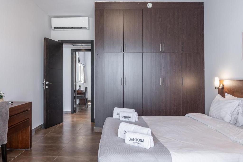 Postel nebo postele na pokoji v ubytování Santona Residence