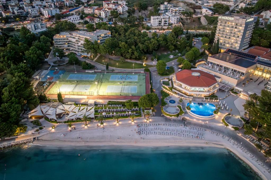 an aerial view of a resort with a pool at Beachfront penthouse Residence in Podstrana