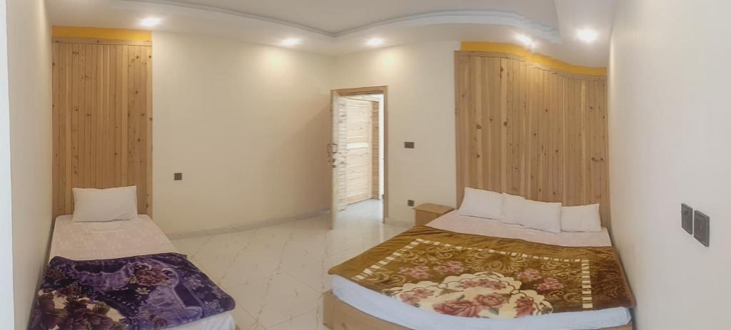 Postel nebo postele na pokoji v ubytování Ruby Lodges Upeer Neelum