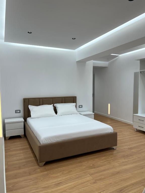 Ένα ή περισσότερα κρεβάτια σε δωμάτιο στο Poseidon Apartments
