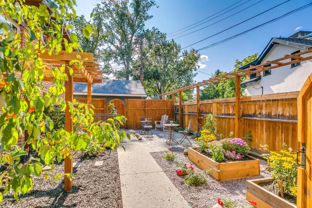 a garden with a fence and a table and chairs at Red Ivy #4 in Boise