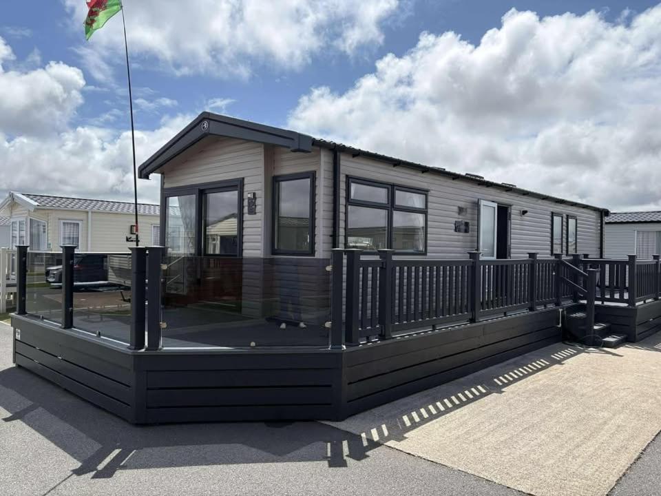 a tiny house sitting in a parking lot at The Retreat Sea Breeze - Golden Sands Holiday Park in Kinmel Bay