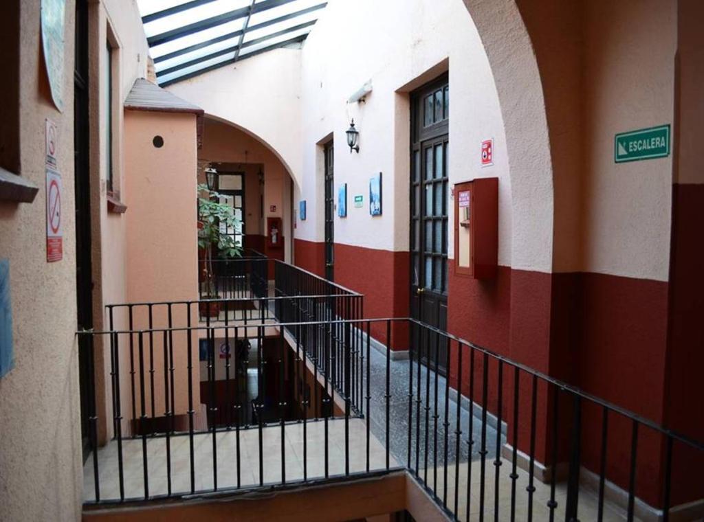 an empty hallway of a building with a staircase at Hotel Victoria in Puebla