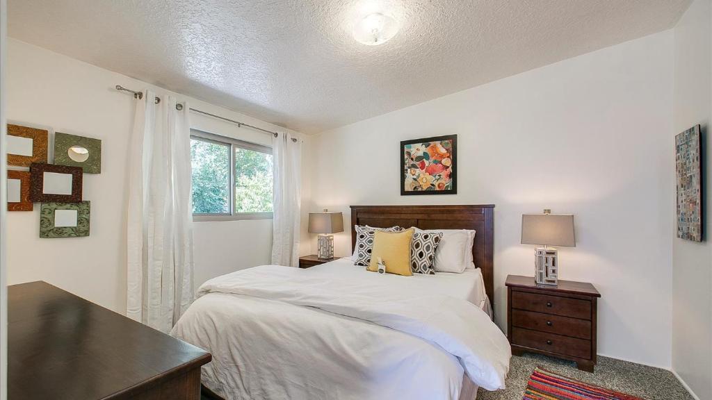 a bedroom with a bed and a desk and a window at Red Ivy #5 in Boise