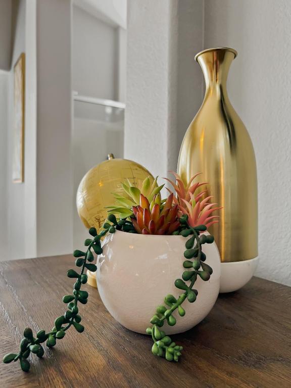 a vase with flowers in it sitting on a table at Kimberly Surprise in Surprise