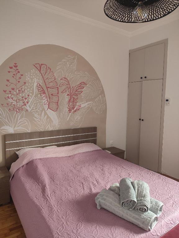 Llit o llits en una habitació de KaranosHouse