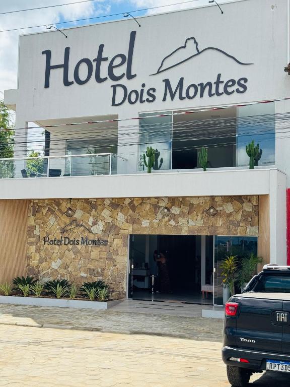 a car parked in front of a hotel does wonders at Hotel Dois Montes in Itamaraju