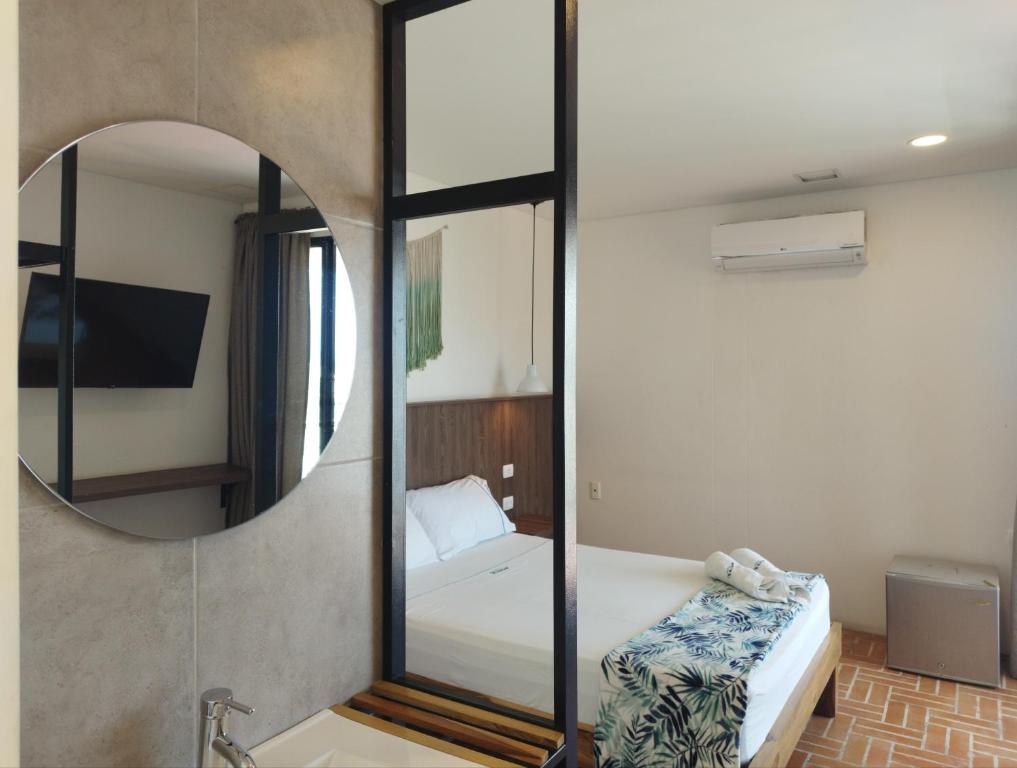 Postel nebo postele na pokoji v ubytování Hotel Macaw Cúcuta