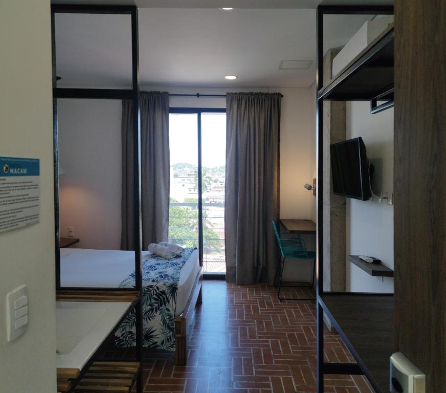 TV a/nebo společenská místnost v ubytování Hotel Macaw Cúcuta