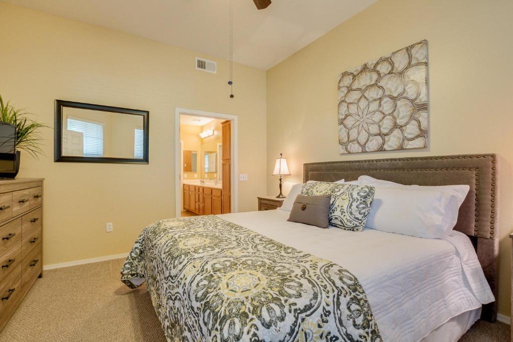 a bedroom with a bed with a laptop on it at Mountain View #11107 Surprise in Surprise