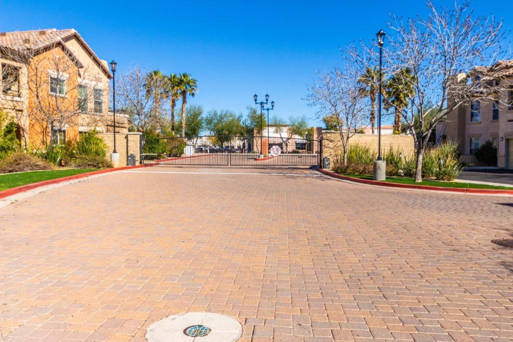 a brick driveway in front of a building at Mountain View #912 Surprise in Surprise