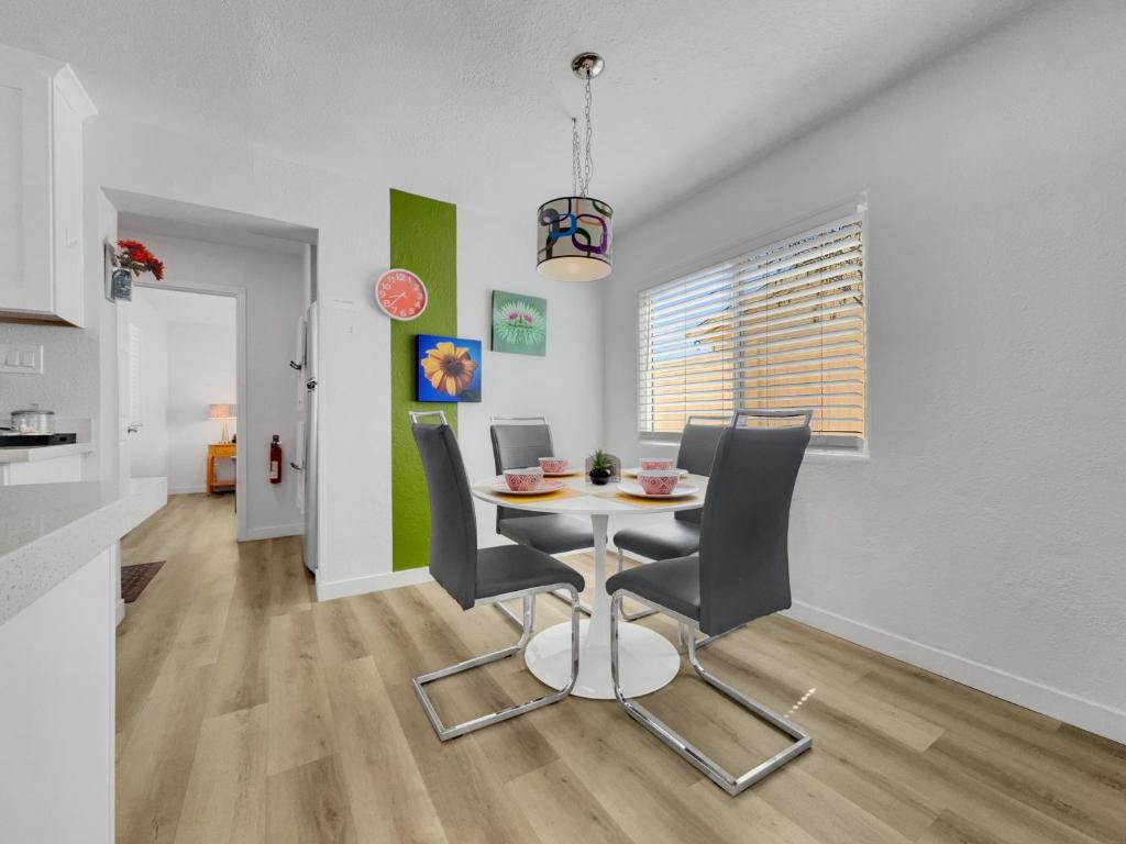 a dining room and kitchen with a table and chairs at Drew 251 Mesa in Mesa