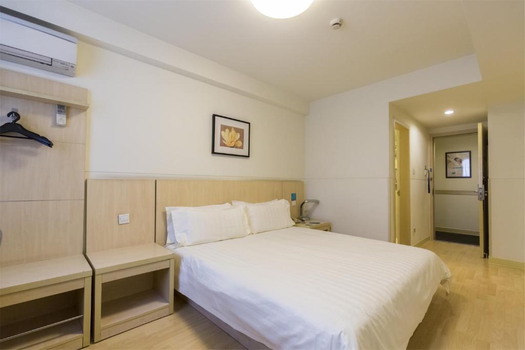 Vuode tai vuoteita majoituspaikassa Jinjiang Inn Shenyang Zhongshan Park
