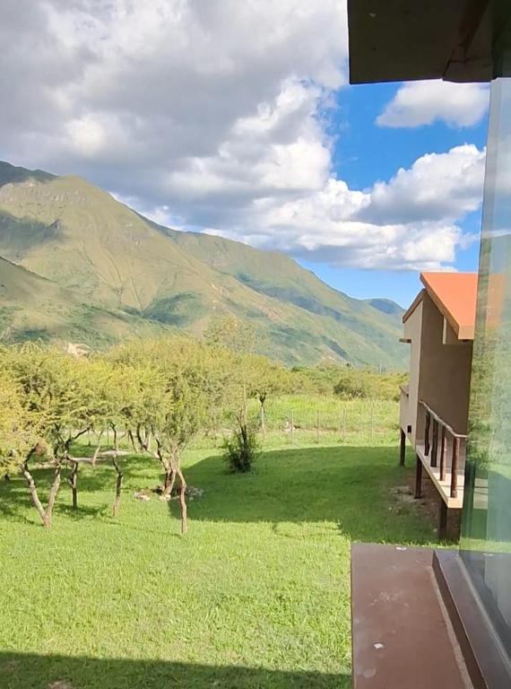 a view of a house with a view of a mountain at Barcena Houses in Tumbaya