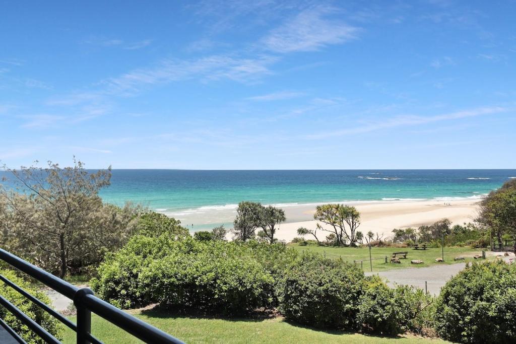 a view of the beach from a balcony at Acutterbove - Stradbroke Escape in Point Lookout