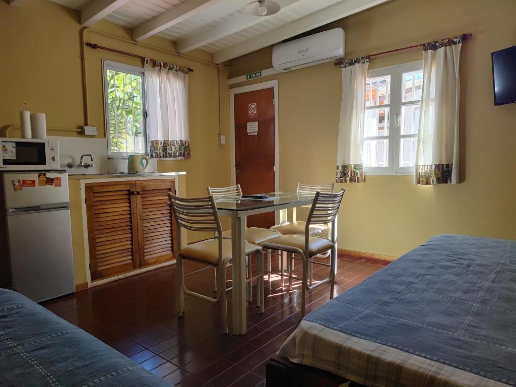 a kitchen with a table and chairs in a room at MI CASA APARTS in Tunuyán