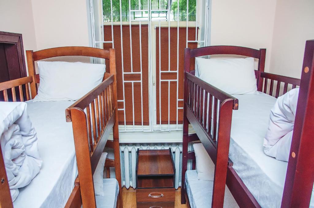 Postel nebo postele na pokoji v ubytování Globus Hostel